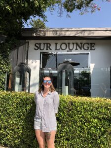 Melissa, a self appointed Scandoval reporter and vice president of Resplendent, standing in front of SUR Lounge in Los Angeles. 
